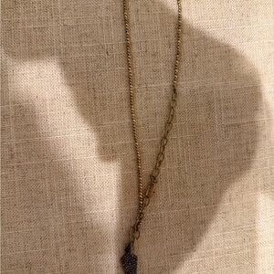 Gold necklace with pointy charm